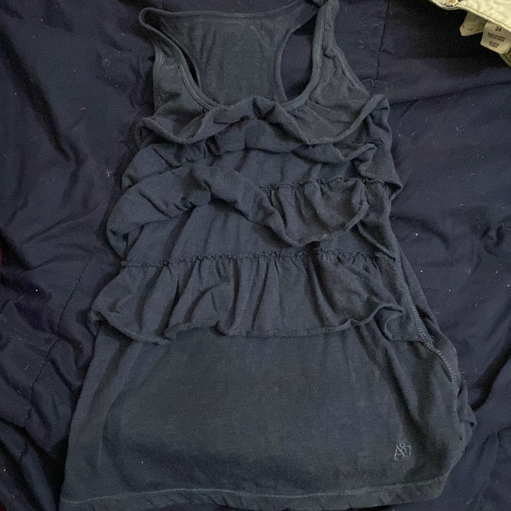 A87 tank top. Thick straps with flare. Blue colored. Size XS.